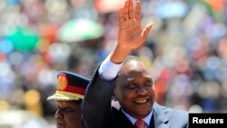 Kenya's President Uhuru Kenyatta arrives to attend Mashujaa (Heroes) Day at the Nyayo National Stadium in capital Nairobi, Oct. 20, 2013. 