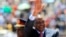 Kenya's President Uhuru Kenyatta arrives to attend Mashujaa (Heroes) Day at the Nyayo National Stadium in capital Nairobi, Oct. 20, 2013. 