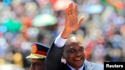 Kenyan President Uhuru Kenyatta arrives to attend Mashujaa Day at the Nyayo National Stadium, Nairobi, Oct. 20, 2013.