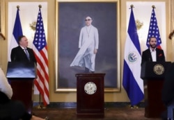 U.S. Secretary of State Mike Pompeo, left, listens to simultaneous translation as El Salvador's President Nayib Bukele speaks at the Presidential House in San Salvador, El Salvador, Sunday, July 21, 2019.