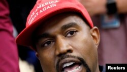 FILE - Rapper Kanye West speaks during a meeting with U.S. President Donald Trump to discuss criminal justice reform in the Oval Office of the White House in Washington, Oct., 11, 2018.