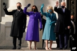 President-elect Joe Biden, his wife Jill Biden and Vice President-elect Kamala Harris and her husband Doug Emhoff arrive at the steps of the U.S. Capitol for the start of the official inauguration ceremonies, in Washington, Wednesday, Jan. 20, 2021