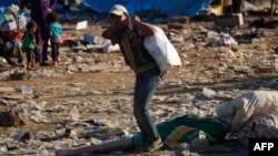 Displaced Syrians from the Daraa province fleeing shelling by pro-government forces are seen in a makeshift camp on the Jordanian border, near the town of Nasib, southern Syria, July 2, 2018.