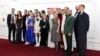 FILE - Cast members pose upon arrival at the premiere for 'The Crown' season 6 finale, in London on Dec. 5, 2023. Even when hit TV series such as "The Crown" or "Bridgerton" have wide appeal, Netflix still tries to cater to the divergent tastes in its vast audience.