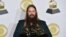 Chris Stapleton poses in the press room with his awards for best country solo performance for "Either Way", best country song for "Broken Halos" and best country album for "From a Room: Volume 1" at the 60th annual Grammy Awards at Madison Square Garden on Sunday, Jan. 28, 2018, in New York.