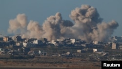 Smoke rises inside the Gaza Strip, as seen from southern Israel