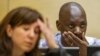 FILE - Congolese warlord Thomas Lubanga is seen at his appeals hearing at the International Criminal Court in The Hague, December 2014.