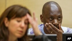 FILE - Congolese warlord Thomas Lubanga is seen at his appeals hearing at the International Criminal Court in The Hague, December 2014.