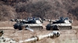 FILE PHOTO: South Korean army's K-55 self-propelled artillery vehicles take part in a military exercise near the demilitarised zone separating the two Koreas in Paju