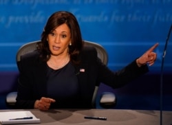 FILE - Democratic vice presidential candidate Sen. Kamala Harris, D-Calif., responds to Vice President Mike Pence during the vice presidential debate n the campus of the University of Utah in Salt Lake City, Oct. 7, 2020.