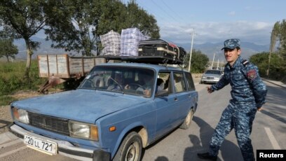 Nagorno-Karabakh refugees begin arriving in Armenia after Azerbaijan's  military offensive