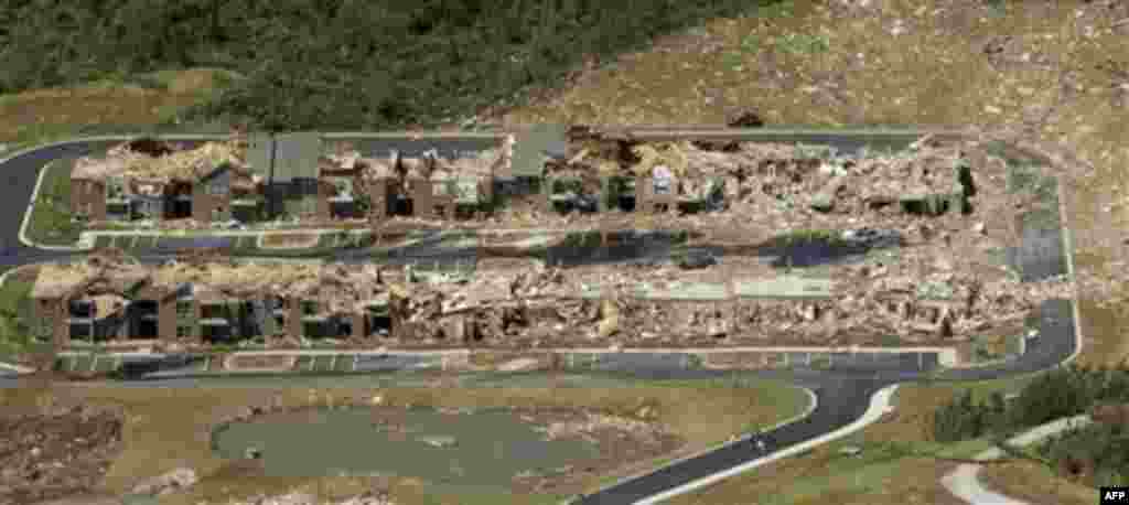 This is an aerial view of tornado damage to an apartment complex in Tuscaloosa, Ala., Thursday, April 28, 2011. Firefighters searched one splintered pile after another for survivors Thursday, combing the remains of houses and neighborhoods pulverized by t