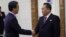 Ri Son Gwon, right, chairman of the North's Committee for the Peaceful Reunification of North Korea, shakes hands with South Korean Unification Minister Cho Myoung-gyon at the Pyongyang Airport in Pyongyang, North Korea, Oct. 4, 2018. The delegation flew to North Korea on Thursday for a joint celebration of the anniversary of a 2007 summit and to possibly hold further peace talks. 