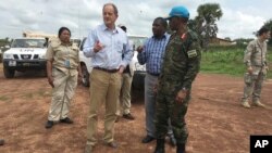 David Shearer, second left, the United Nations peacekeeping mission chief in South Sudan, visits the troubled region of Yei, South Sudan, July 13. 2017. Shearer says he's considering putting a permanent U.N. presence in the town, but only if the government grants unrestricted access.