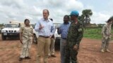 David Shearer, second left, the United Nations peacekeeping mission chief in South Sudan, visits the troubled region of Yei, South Sudan, July 13. 2017. Shearer says he's considering putting a permanent U.N. presence in the town, but only if the gove...