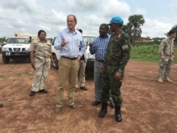 FILE - David Shearer, second left, the United Nations peacekeeping mission chief in South Sudan, visits the troubled region of Yei, July 13. 2017.