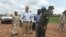 David Shearer, second left, the United Nations peacekeeping mission chief in South Sudan, visits the troubled region of Yei, South Sudan, July 13. 2017. Shearer says he's considering putting a permanent U.N. presence in the town, but only if the gove...