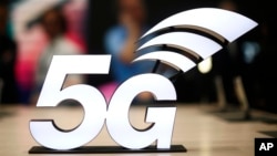 A banner of the 5G network is displayed during the Mobile World Congress wireless show, in Barcelona, Spain, Feb. 25, 2019. 