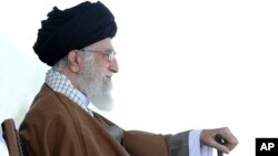 In this picture released by official website of the office of the Iranian supreme leader, May 10, 2017, Supreme Leader Ayatollah Ali Khamenei attends a graduation ceremony for Revolutionary Guard cadets in Tehran. Iran's supreme leader acknowledged his country faces deep problems.
