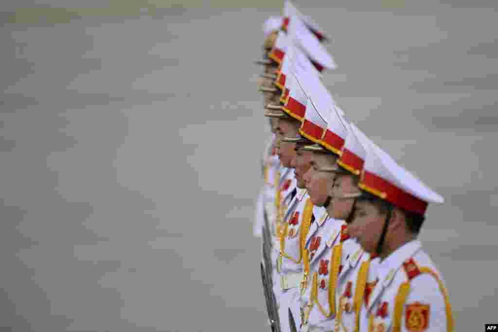 Members of a Vietnamese honor guard stand at attention during the arrival of leaders at the international airport ahead of the Asia-Pacific Economic Cooperation (APEC) Summit in Danang.