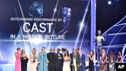 Frances McDormand and the cast of "Three Billboards Outside Ebbing, Missouri" accept the award for outstanding performance by a cast in a motion picture at the 24th annual Screen Actors Guild Awards at the Shrine Auditorium & Expo Hall on Sunday, Jan. 21, 2018, in Los Angeles.