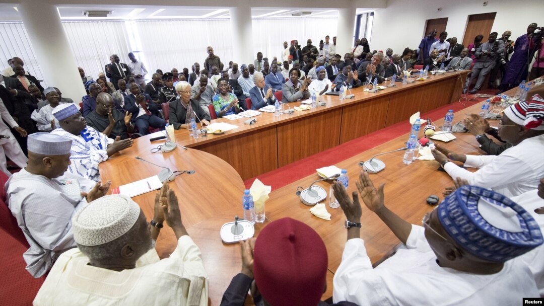 International Monetary Fund (IMF) Managing Director Christine Lagarde is applauded after speaking to members of parliament at the National Assembly in Abuja, Nigeria, in this January 6, 2016 handout photo by IMF. REUTERS/Stephen Jaffe/IMF Staff Photo/Hand