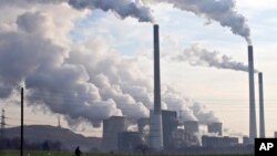 FILE - Coal burning power plants are the biggest source of carbon pollution, which is responsible for climate change.