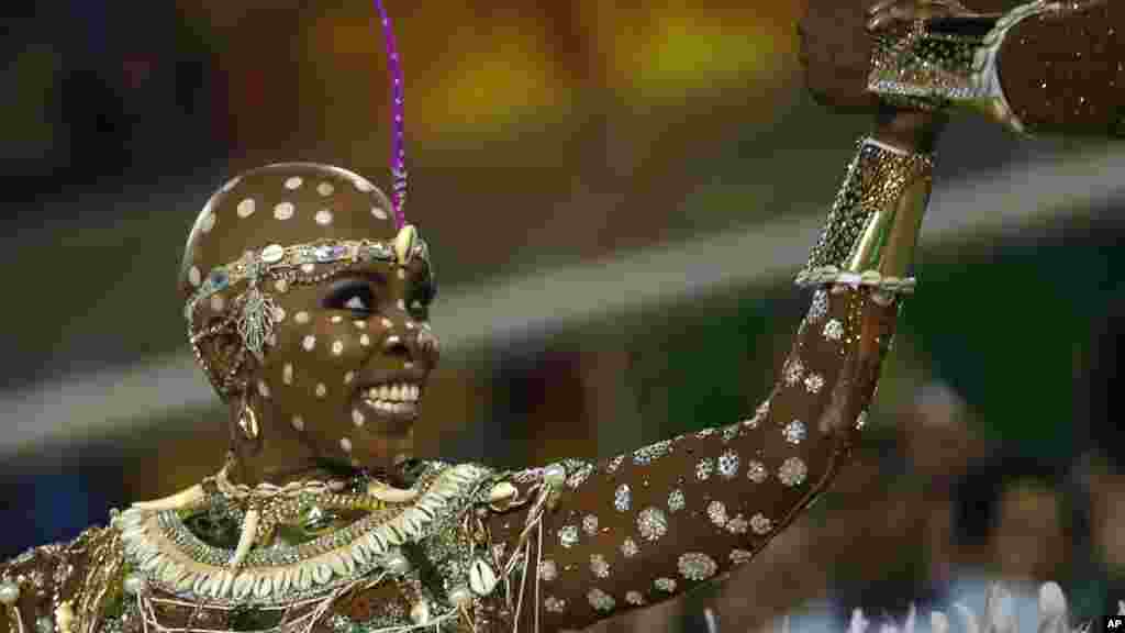A performer from the Mangueira samba school parades during carnival celebrations at the Sambadrome in Rio de Janeiro, Brazil.