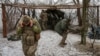 FILE - Ukrainian servicemen fire a D-20 howitzer toward Russian troops, amid Russia's attacks on Ukraine, near the front line town of Pokrovsk in Ukraine's Donetsk region, Feb. 6, 2025. (Radio Free Europe/Radio Liberty/Serhii Nuzhnenko via Reuters)