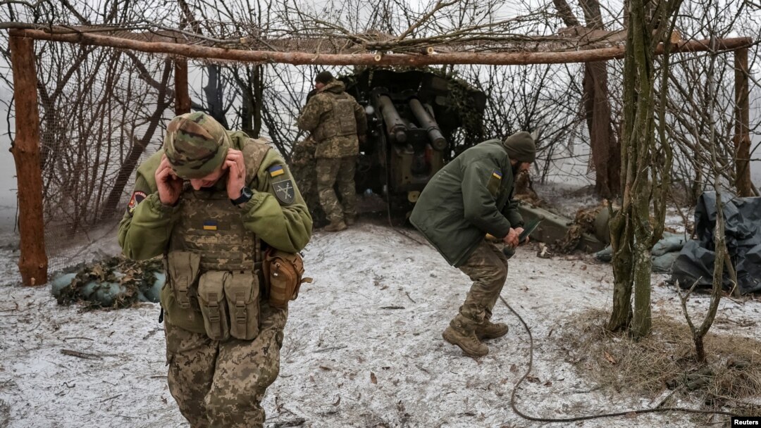 FILE - Ukrainian servicemen fire a D-20 howitzer toward Russian troops, amid Russia's attacks on Ukraine, near the front line town of Pokrovsk in Ukraine's Donetsk region, Feb. 6, 2025. (Radio Free Europe/Radio Liberty/Serhii Nuzhnenko via Reuters)