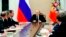 FILE - Russian President Vladimir Putin, center, leads a Security Council meeting in Moscow, Russia, March 30, 2018.