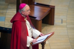 FILE - Los Angeles Archbishop Jose Gomez leads Catholics in prayer during a National Moment of Prayer at the Cathedral of Our Lady of the Angels in Los Angeles, April 10, 2020. The church has been livestreaming services during the pandemic lockdown.