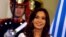 FILE - Argentina's President Cristina Fernandez de Kirchner smiles during a ceremony on her last day in office at the Casa Rosada Presidential Palace in Buenos Aires, Argentina, Dec. 9, 2015. 