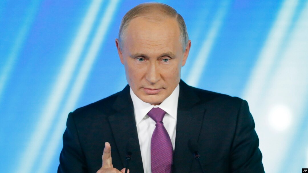 FILE - Russian President Vladimir Putin gestures speaking at a meeting of the Valdai International Discussion Club in Sochi, Russia, Oct. 19, 2017