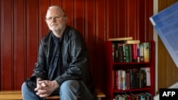 Norwegian playwright Jon Fosse poses for a photo at his home near Frekhaug, north of Bergen in Norway on October 5, 2023, after the Swedish Academy awarded him the 2023 Nobel literature prize. (Photo by EIRIK HAGESAETER / Bergensavisen / AFP)