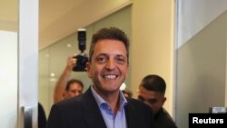Argentine politician Sergio Massa smiles after a meeting with presidential candidate Alberto Fernandez (not pictured), in Buenos Aires, Argentina, June 12, 2019.
