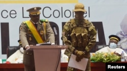 FILE - Col. Assimi Goita, interim president, speaks during his inauguration in Bamako, Mali, June 7, 2021. 
