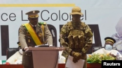 FILE - Col. Assimi Goita, interim president, speaks during his inauguration in Bamako, Mali, June 7, 2021. An estimated 3,000 Malians marched Sept. 22, 2021, through Bamako's streets in support of his government.