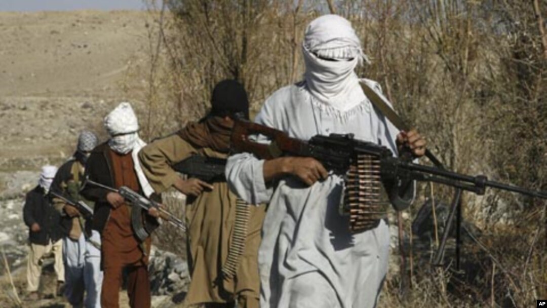 Taliban fighters in an undisclosed location in Nangarhar province, Afghanistan, December 13, 2010