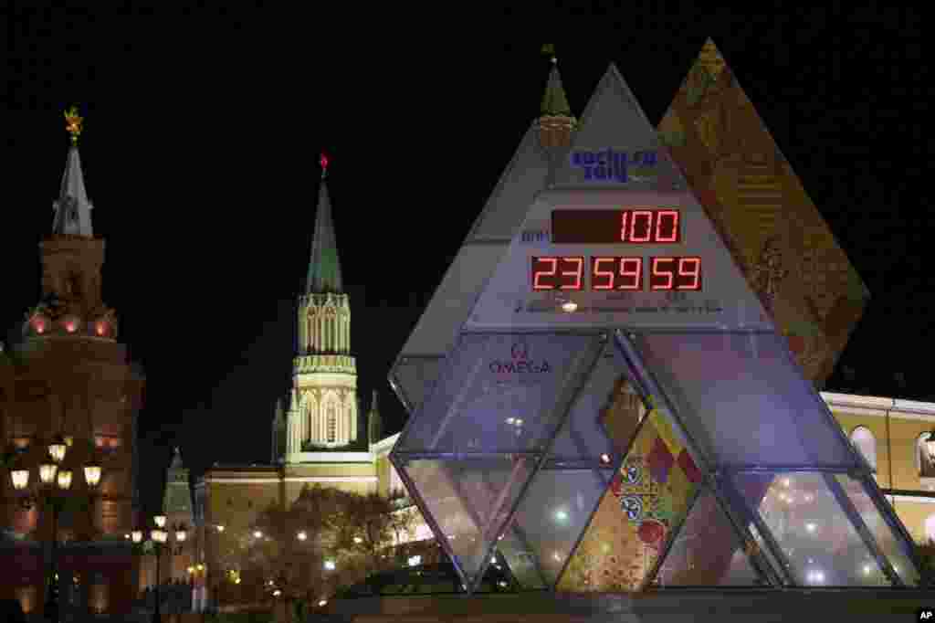 The countdown clock showing 100 days left until the start of 2014 Winter Olympic Games is on display at Manezhnaya square in downtown Moscow, Russia.