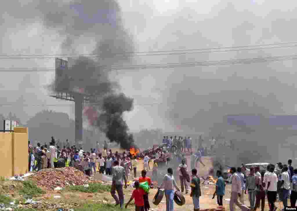 People take part in protests over fuel subsidy cuts in Khartoum September 25, 2013. U.S. Special Envoy to the Sudans, Donald Booth, told VOA News that fuel subsidies are believed to cost the government in Khartoum the same as the wars in Darfur, South Kordofan and Blue Nile states.