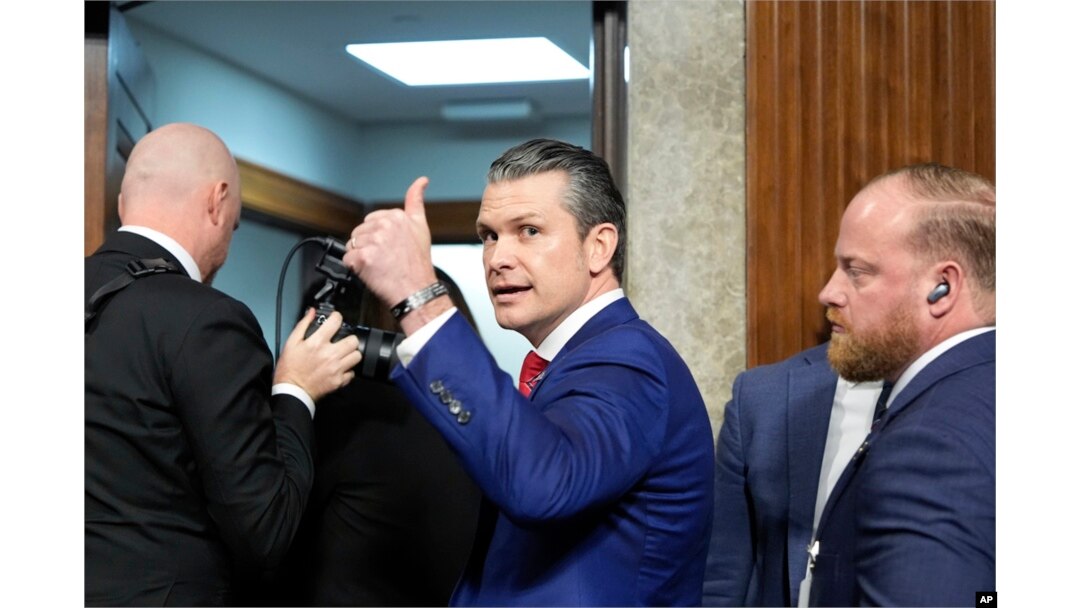 FILE - Pete Hegseth, President Donald Trump's nominee for defense secretary, gives a thumbs up while leaving after his Senate Armed Services Committee confirmation hearing, at the Capitol in Washington, Jan. 14, 2025.