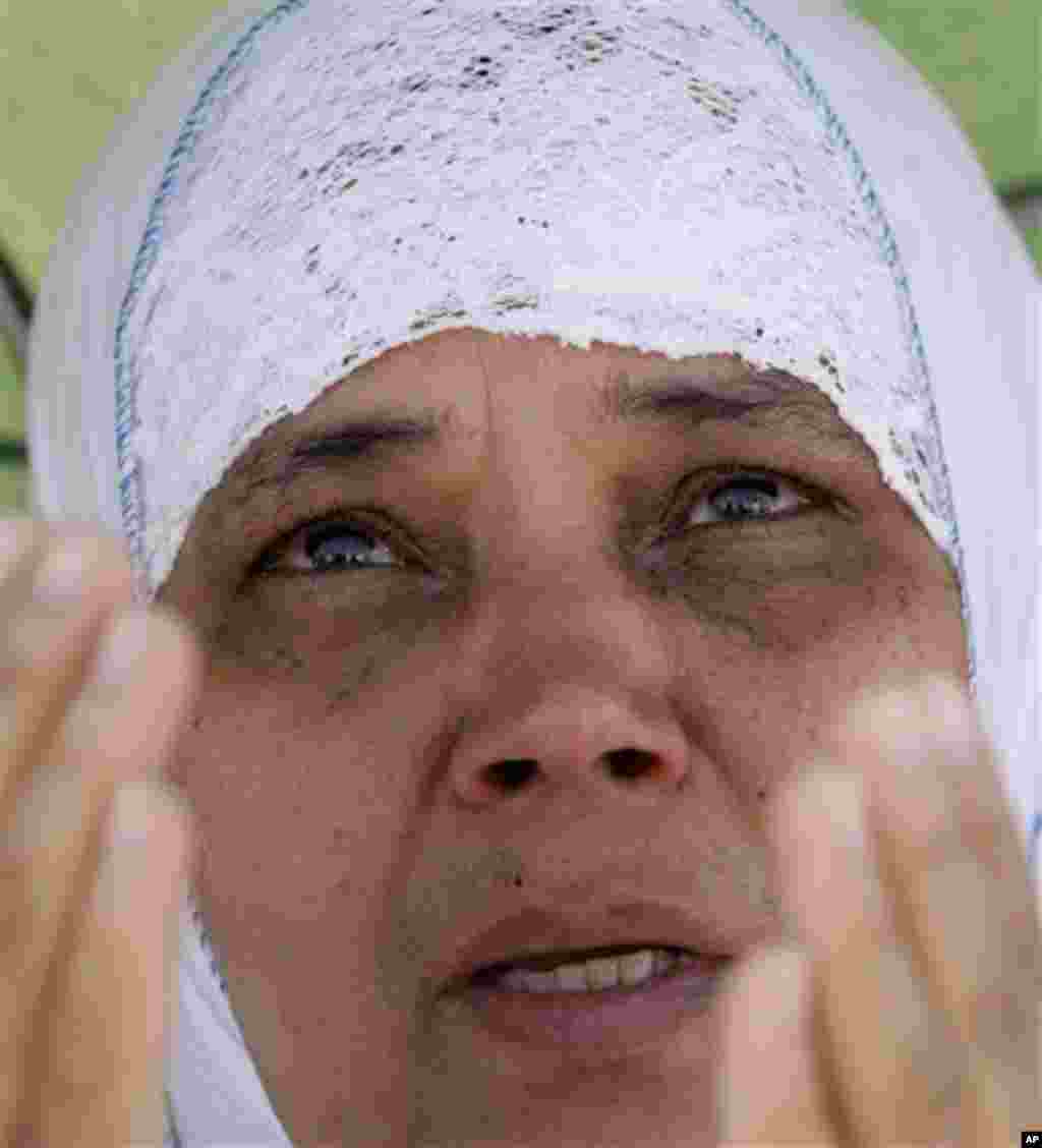 A Muslim pilgrim prays on a rocky hill called the Mountain of Mercy, on the Plain of Arafat near Mecca, Saudi Arabia, Monday, Nov. 15, 2010. The annual Islamic pilgrimage draws 2,5 million visitors each year, making it the largest yearly gathering of peop