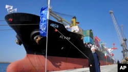 FILE - Hassan Rouhani, who was president of Iran in 2017, poses during the inauguration a newly built extension of the port of Chabahar, near the Pakistani border, on the Gulf of Oman, southeastern Iran, Dec. 3, 2017. 