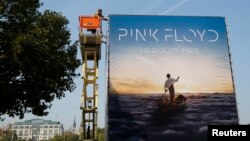 Advertising for the new Pink Floyd album "The Endless River" is installed on a four-sided billboard on the South Bank in London, Sept. 22, 2014. 