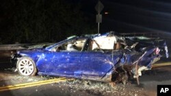 This photo provided by NBC Bay Area-KNTV shows a Tesla car after it was pulled from a pond near the city of San Ramon, California, May 21, 2018. 
