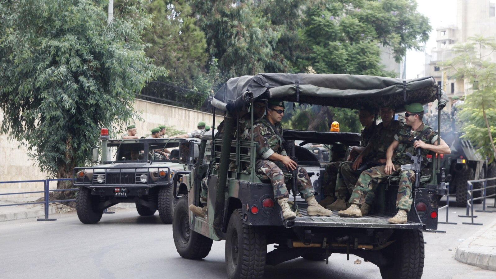  Lebanese Army soldiers sit in their military vehicles as they are deployed to secure the area near the French embassy in Beirut, September 21, 2012.