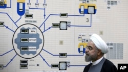 FILE - President Hassan Rouhani visits the Bushehr nuclear power plant just outside the port city of Bushehr, Iran, Jan. 13, 2015, in this photo released by the Iranian Presidency Office.