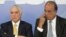 Brazil's President Michel Temer, left, sits next to the Governor of Rio de Janeiro Luiz Fernando Pezao, during the signing of a decree for the military intervention of Rio de Janeiro's local police, in Brasilia, Brazil, Feb. 16, 2018.