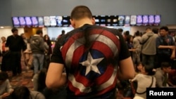 Fans of the Avengers series wait for an early premiere of "The Avengers: Endgame" movie in La Paz, Bolivia, April 24, 2019. 